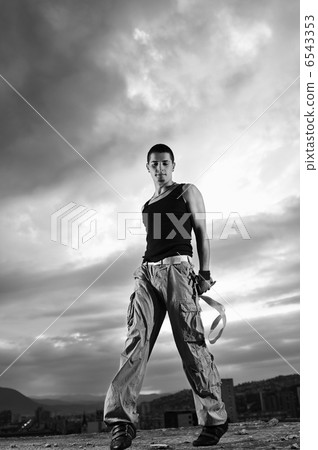 young man dancing and jumping on top of the building young man dancing and jumping on top of the building 6543353