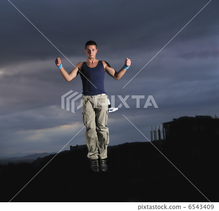 young man dancing and jumping young man dancing and jumping 6543409