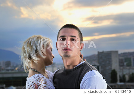 romantic urban couple dancing on top of bulding romantic urban couple dancing on top of bulding 6543440
