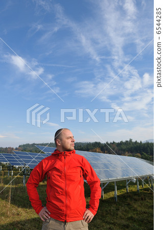 Male solar panel engineer at work place 6544285