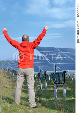 Male solar panel engineer at work place Male solar panel engineer at work place 6544468