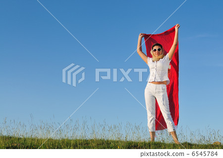 beautiful woman with red scarf on meadow beautiful woman with red scarf on meadow 6545784