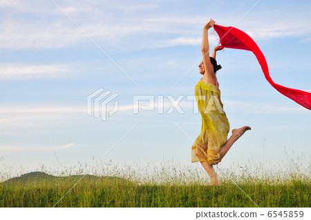 beautiful woman with red scarf on meadow beautiful woman with red scarf on meadow 6545859
