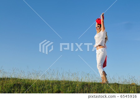 beautiful woman with red scarf on meadow beautiful woman with red scarf on meadow 6545916