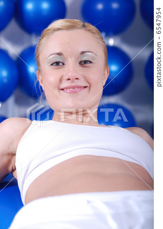 young woman exercising with pilates ball young woman exercising with pilates ball 6547954
