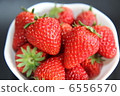 Fresh strawberries served in white dishes 6556570