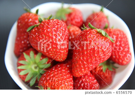 Fresh strawberries served in white dishes 6556570
