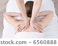 A woman undergoing body treatment 6560888