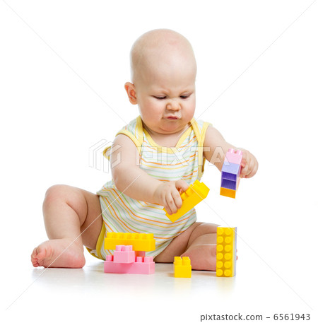 kid boy playing with construction set over white background kid boy playing with construction set over white background 6561943