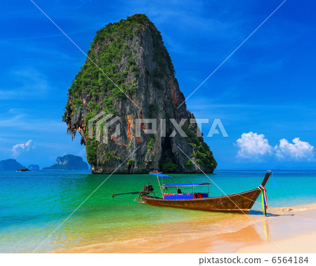Thailand exotic tropical beach. Blue sky, sand and traditional b Thailand exotic tropical beach. Blue sky, sand and traditional b 6564184