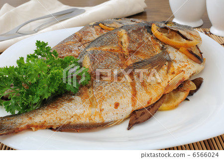 Baked fish with lemon Dorado Baked fish with lemon Dorado 6566024