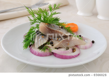 Slices of salted herring with onions and spices Slices of salted herring with onions and spices 6566028