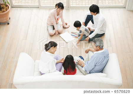 Three-generation family relaxing in the living room Three-generation family relaxing in the living room 6570820