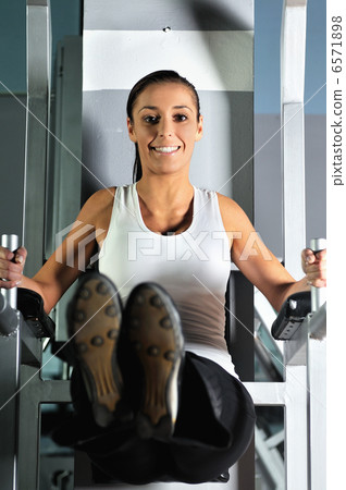 young woman practicing fitness and working out 6571898