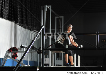 young woman practicing fitness and working out 6572011