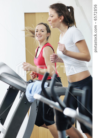 woman workout in fitness club on running track 6572856