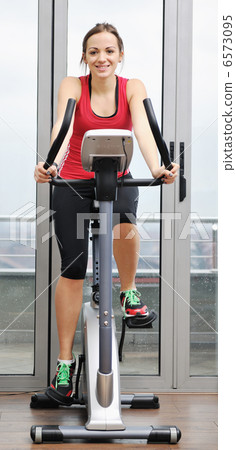 womanworkout in fitness club on running track machine womanworkout in fitness club on running track machine 6573095