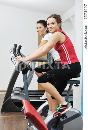 woman workout in fitness club on running track 6573097