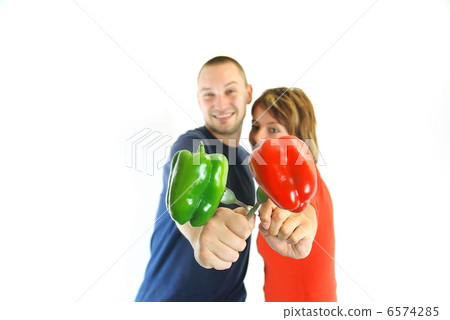 happy couple with peppers isolated happy couple with peppers isolated 6574285