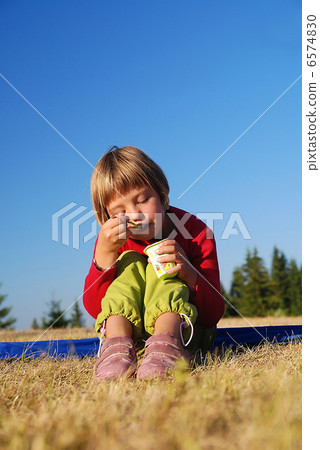happy girl eating healthy food in nature happy girl eating healthy food in nature 6574830