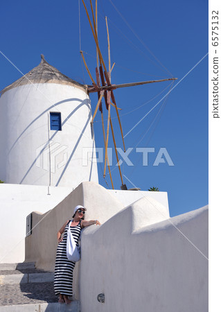 Greek woman on the streets of Oia, Santorini, Greece Greek woman on the streets of Oia, Santorini, Greece 6575132
