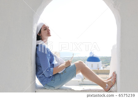Greek woman on the streets of Oia, Santorini, Greece 6575239