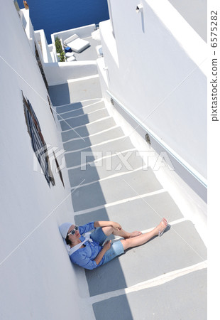 Greek woman on the streets of Oia, Santorini, Greece 6575282