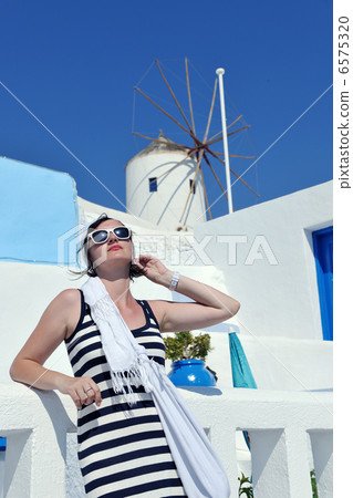 Greek woman on the streets of Oia, Santorini, Greece 6575320