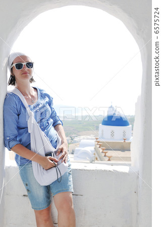 Greek woman on the streets of Oia, Santorini, Greece 6575724