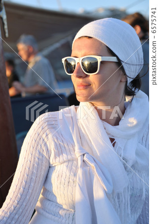 Greek woman on the streets of Oia, Santorini, Greece 6575741