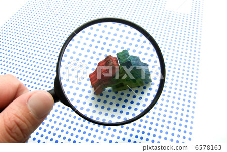 hand with magnifying glass hand with magnifying glass 6578163