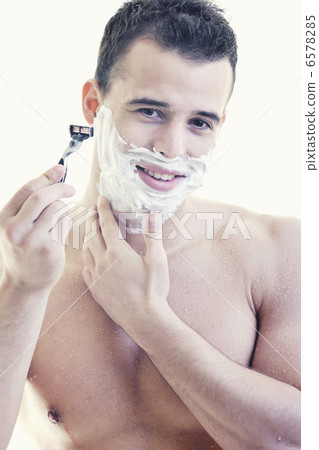 young man shaving young man shaving 6578285
