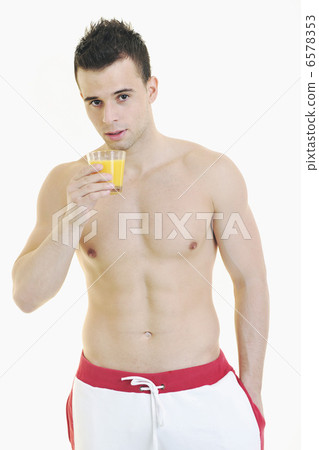 young athlete dringing orange juice young athlete dringing orange juice 6578353