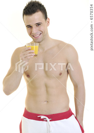 young athlete dringing orange juice young athlete dringing orange juice 6578354