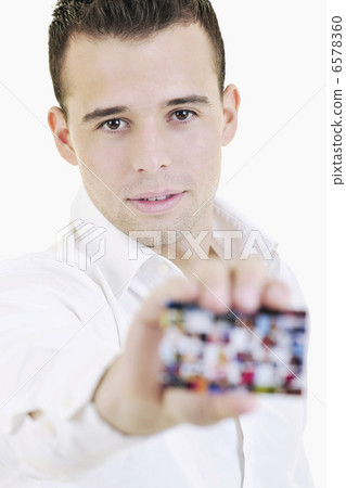 young business man with empty card isolated on white young business man with empty card isolated on white 6578360