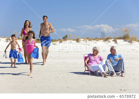 Mother, Father Children & Grandparents Family on Beach 6578972