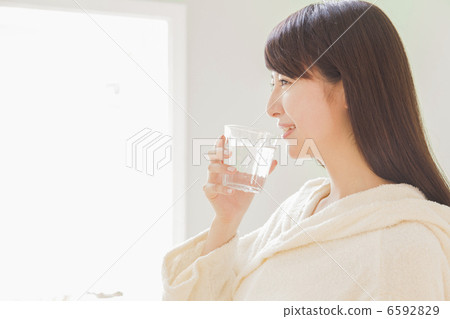 A woman drinking water A woman drinking water 6592829