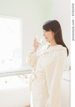A woman drinking water A woman drinking water 6592830