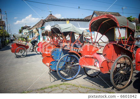 Trishaws in the street of Surakarta, Indonesia 6601042