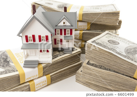 Stacks of Hundreds of Dollars with Small House 6601499