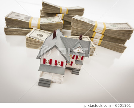 Stacks of Hundreds of Dollars with Small House 6601501