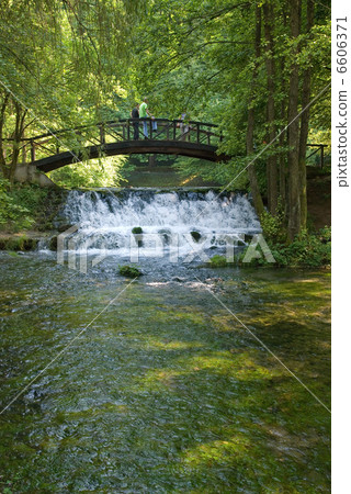 wooden bring over small waterfall wooden bring over small waterfall 6606371