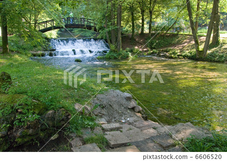 wooden bring over small waterfall 6606520