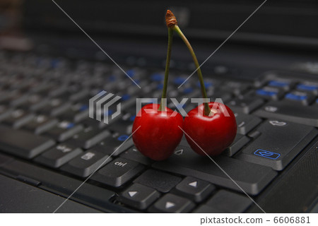 fresh cherry on laptop keyboard 6606881