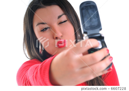woman in red talking on cellphone woman in red talking on cellphone 6607228