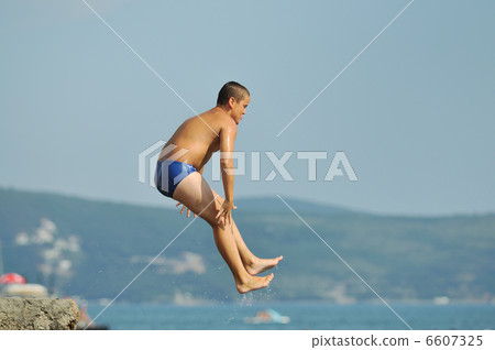 boy jump sea boy jump sea 6607325
