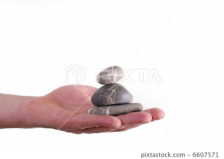 Man holding balanced zen rocks Man holding balanced zen rocks 6607571