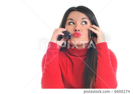 woman in red talking on cellphone woman in red talking on cellphone 6608174