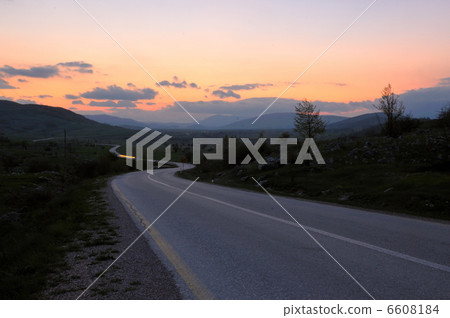countryroad adventure with beautiful sunset 6608184