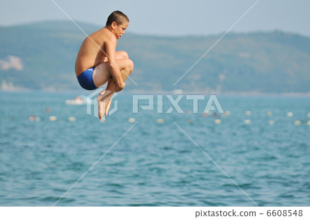 boy jump sea boy jump sea 6608548